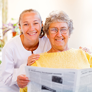 image of a caregiver smiling with a woman