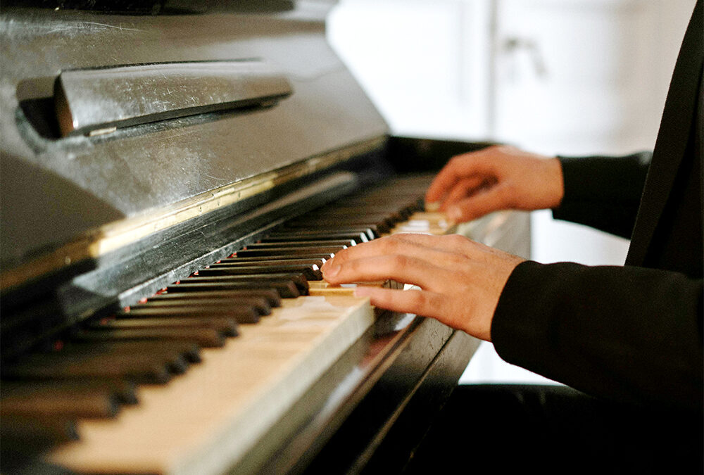 Person playing piano at home
